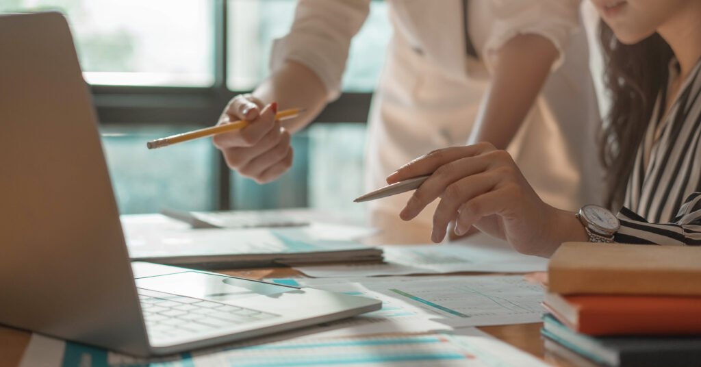 Close up business People Meeting to analyse and discuss and brainstorming the financial report chart data, Financial advisor teamwork and accounting concept